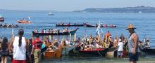 Canoes landing on Alki Beach during the Tribal Canoe Journeys, July 2018