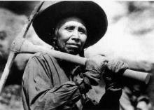 Plasi Cocowee, a memer of the Salish Tribe, works on Kerr Dam at the height of its construction in 1937.